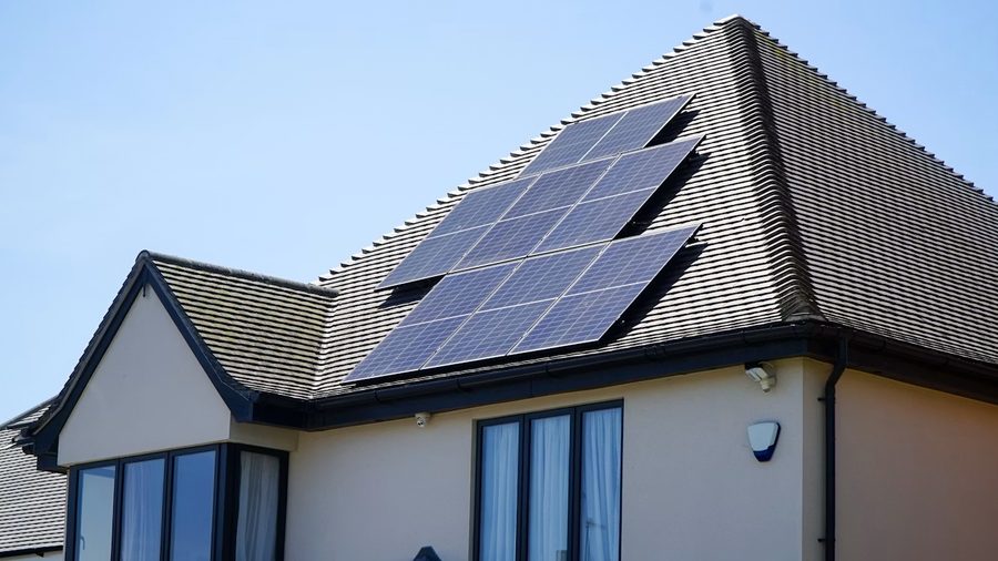 Solar panels installed on the tiled roof of a house