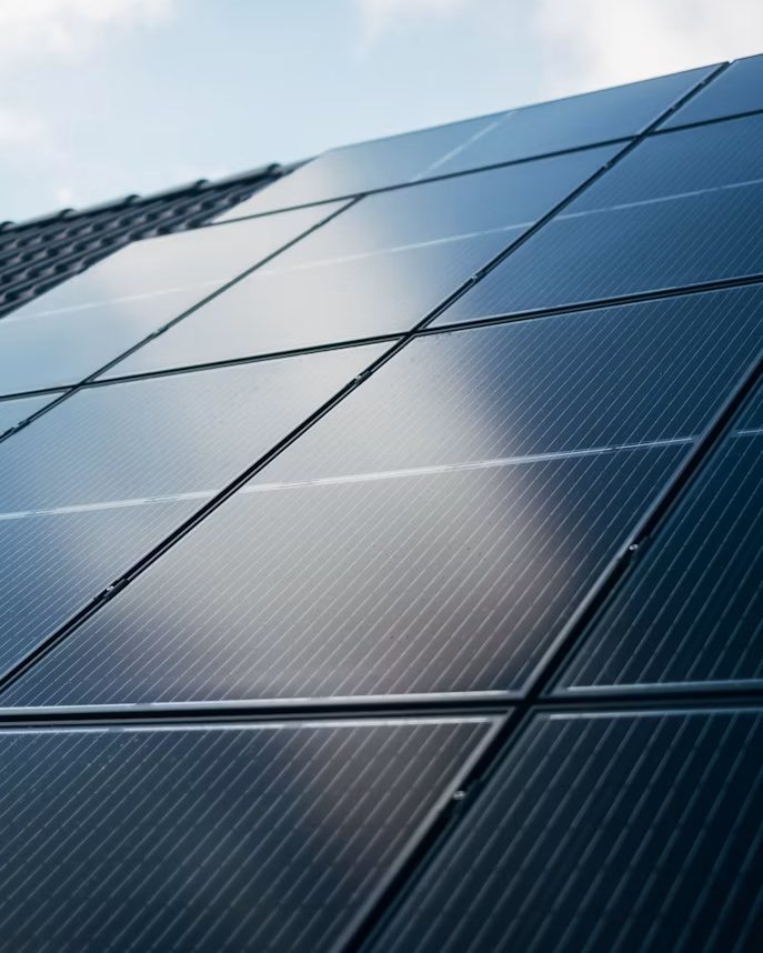 Close view of solar panels against a clear sky
